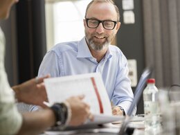 smiling man in meeting | © Scandraft AB